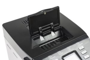 Distributeur dans une machine à pain