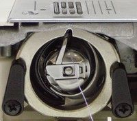 Navette oscillante dans une machine à coudre