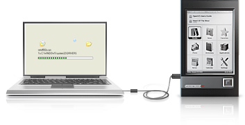 Un livre électronique connecté à un ordinateur.