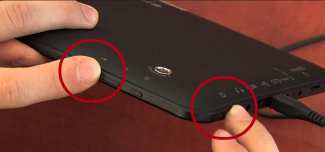 Maintenez le bouton de volume et le bouton d'alimentation enfoncés.